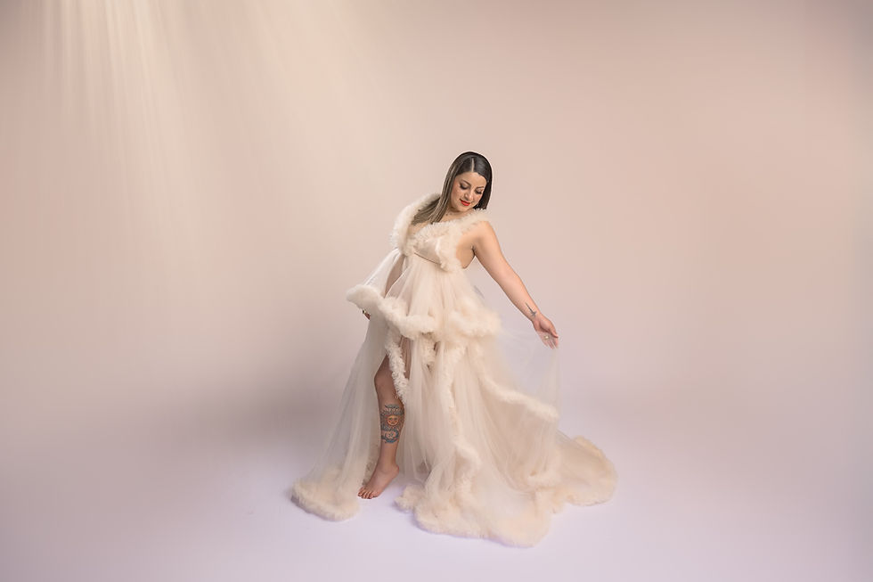 glowing maternity photoshoot with cream tones