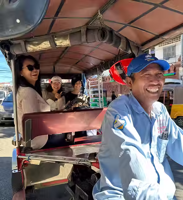 ChildSafe Experiences tuk tuk driver taking tourists to explore Phnom Penh