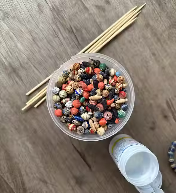Paper beads are used during jewelry classes 