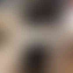 Power tool being modified on a bench with toolbox in background.