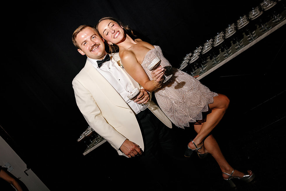 Bride and Groom sharing espresso martinis at their wedding reception at St James in milwaukee wi wed