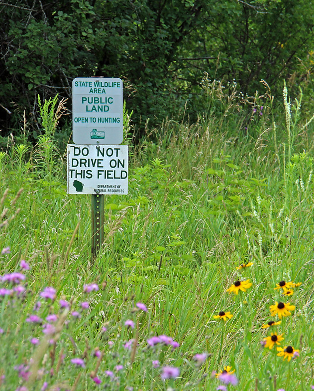 Signs marking state wildlife area along Rustic Road 116 in St. Croix County