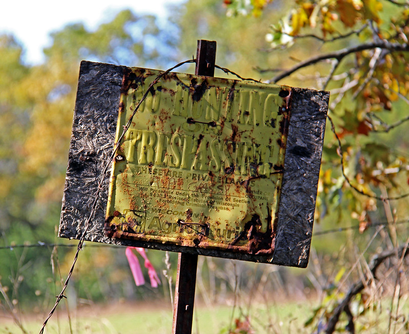 No trespassing sign along Rustic Road 102 in Waushara County