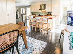 The original sunroom at the rear was demolished to be replaced with a full country kitchen, which faces the main dining area and opens to both north and south gardens and patio areas. 