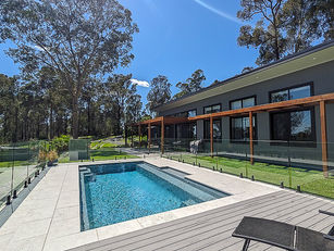 A striking recycled brick feature wall and the polished concrete floor throughout this beautiful eco home complete the elegant yet functional aesthetic.