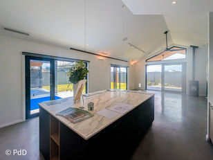 Spacious open-plan kitchen in Googong home designed for entertaining, with natural light, modern finishes, and practical storage solutions.