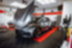 ferrari grise dans garage ppf avec capot ouvert