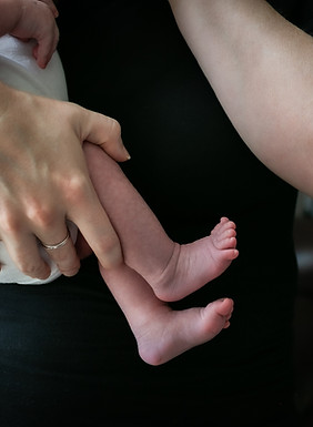 Postpartum Mother holding Newborn
