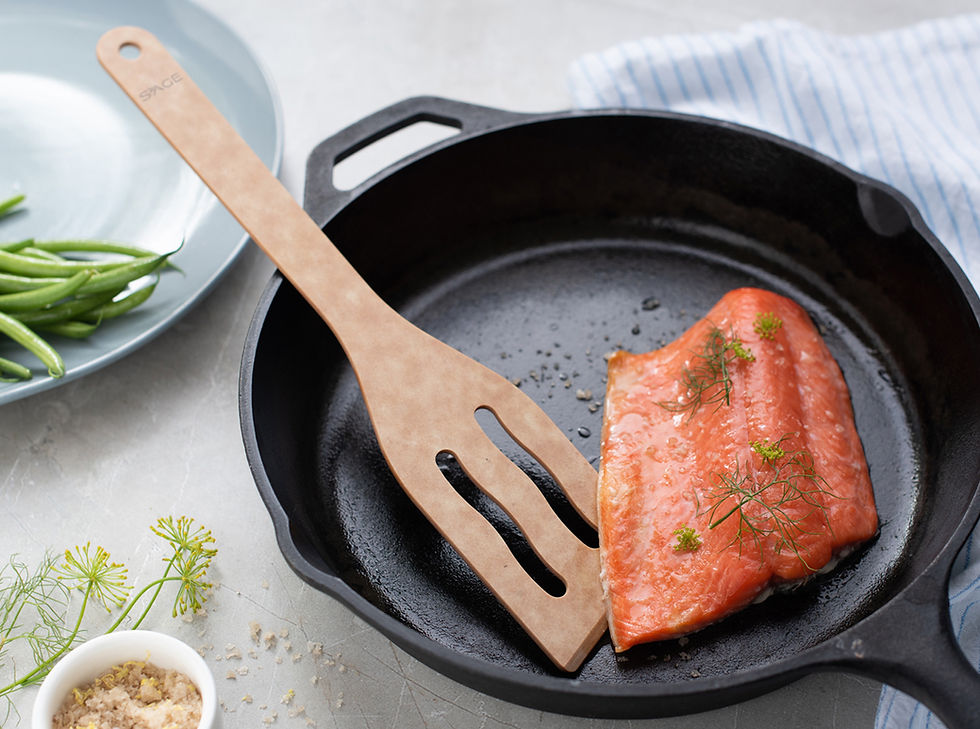Pan-seared salmon fillet in cast iron skillet with Sage turner tool