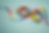 IDD and Autism multi-colored Ribbon on a light blue background