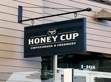 Blade sign for Honey Cup Coffeehouse & Creamery