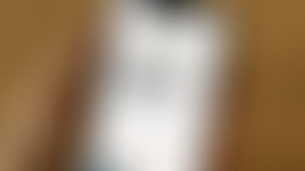 hand holding a phone with scam text