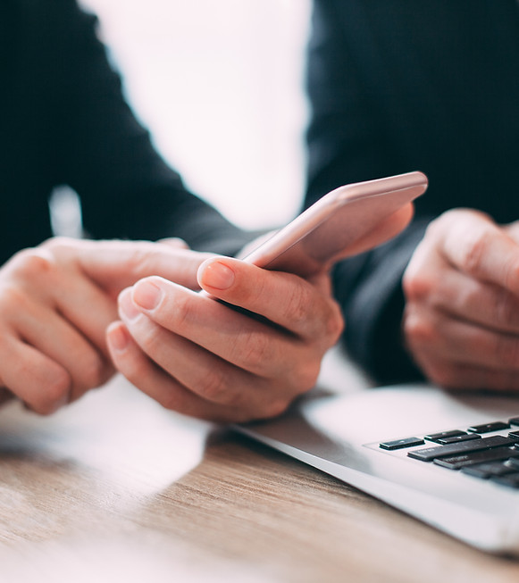 businesswoman-reading-message-mobile-phone.jpg