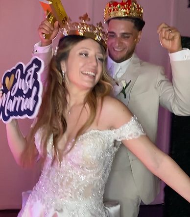 a man and woman wearing wedding clothes at 360 photo booth wedding event serviced by 3sixty Entertainment, LLC