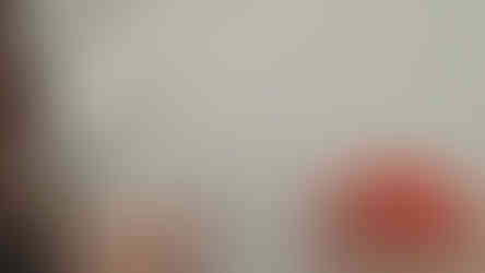 sweater with stains being sprayed with soap