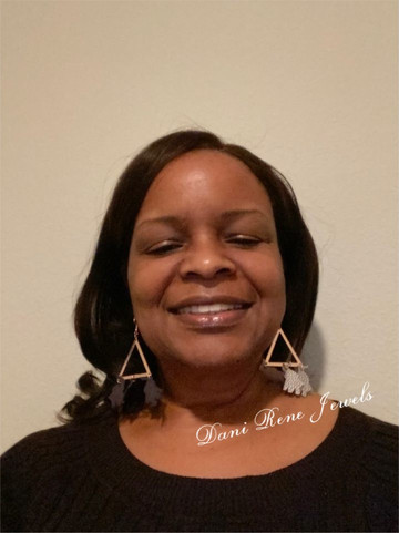 Elegant handcrafted polymer clay dangle earrings, showcasing artisan jewelry from a Black-owned jewelry store.