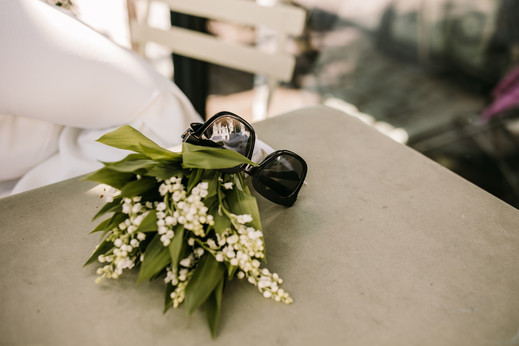 Lilly of the valley wedding bouquet and sunglasses