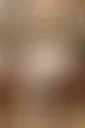 Joyous bride and groom exiting Copenhagen City Hall, hand in hand, as they embark on their new journey together amidst confetti and cheers