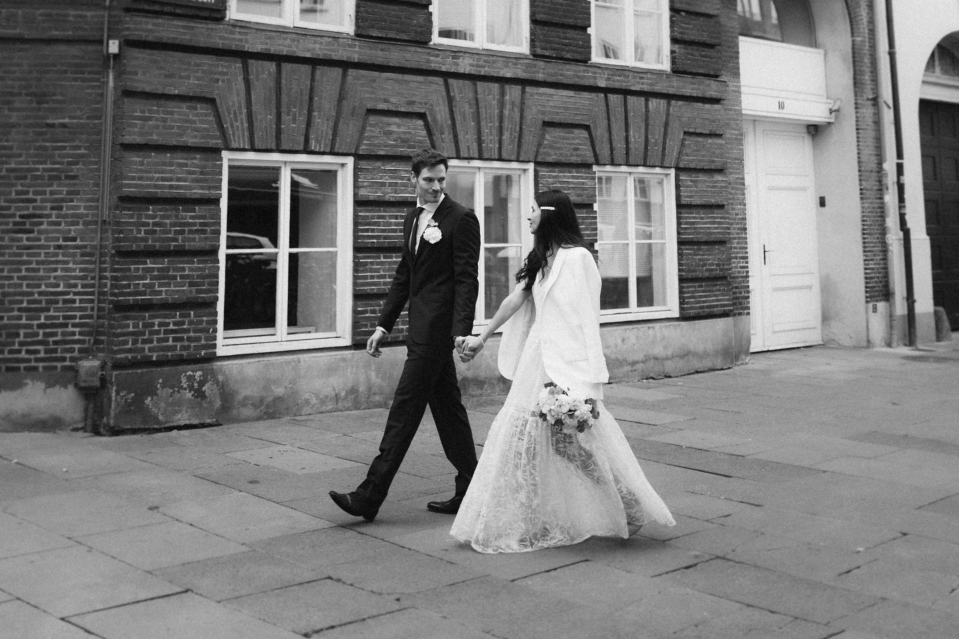 Newlyweds walking through streets of Copenhagen