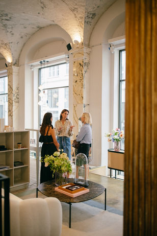 Guests exploring unique jewellery pieces and meeting the designers at Jewellery Room, captured through event photography at Copenhagen Fashion Week.