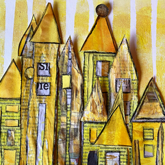 Gelben Häuschen aus Papier als Collage.