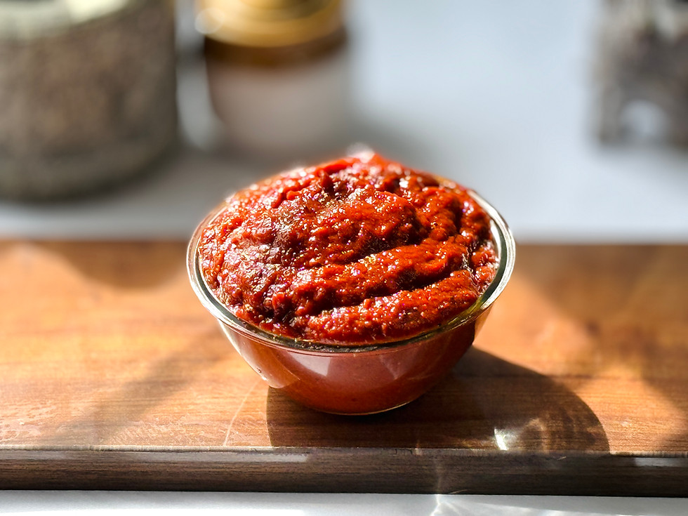 A thick, brownish-red Allam Pachadi (Ginger Relish) served as a dip for idli.