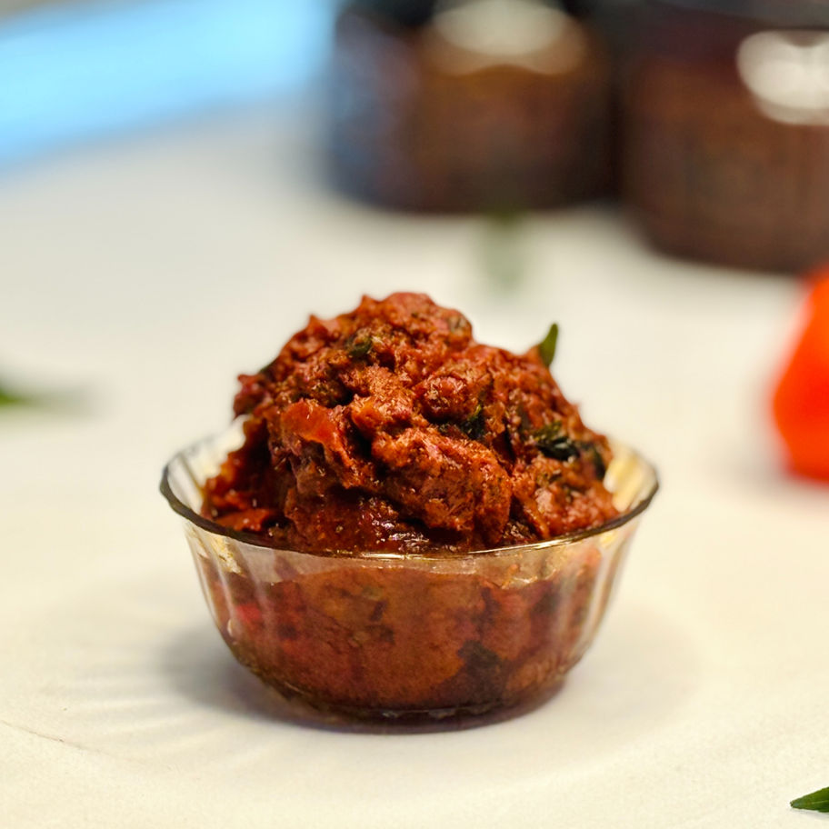 A thick, rich, jammy, and deep red Andhra-style Tomato Pickle.