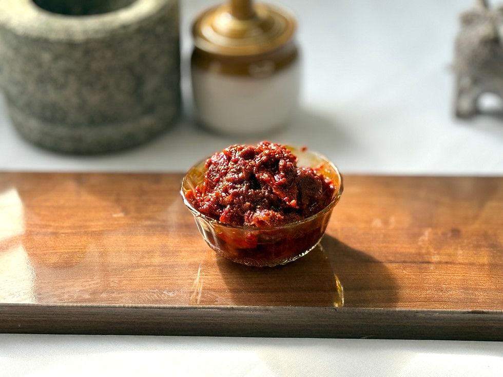 Tender pieces of Nuni Magaya pickle glistening luxuriously in seasoned oil.