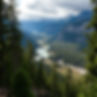 Panoramic view: river valley nestled in majestic mountains