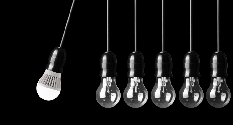 Newtons cradle style image of lightbulbs illustrating impact