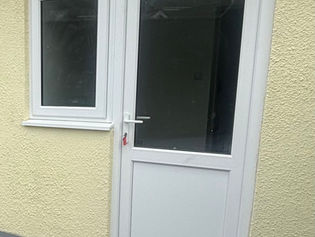 Yellow house with new door and window