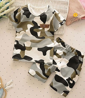 Close-up of Reuben Doll clothing featuring a camouflage pattern.