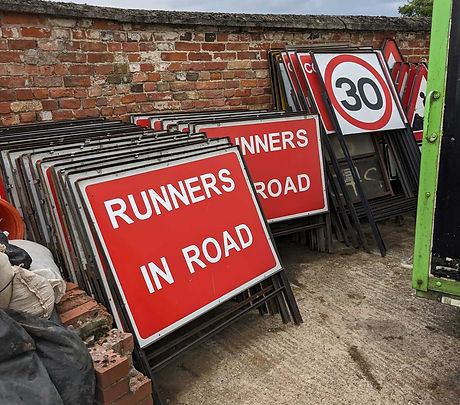 Road signs stacked in a storage yard