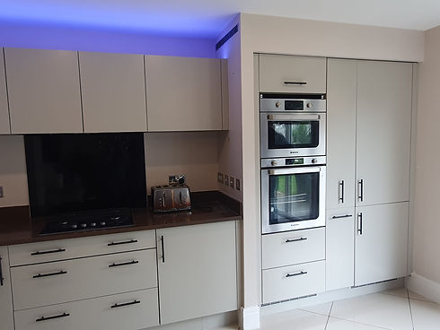 Grey sprayed paint on kitchen units