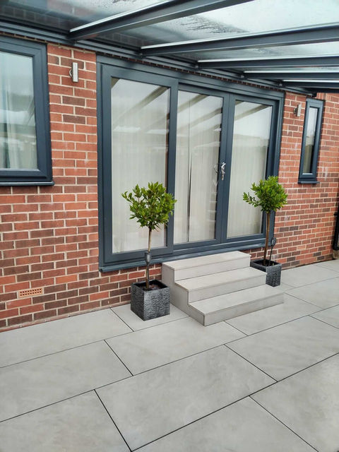 New patio outside back garden door with shelter