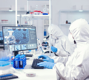 chemist-ppe-suit-typing-keyboard-checking-virus-development-equipped-laboratory-medical-en