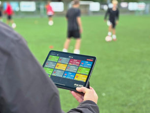 Athletes performing light recovery exercises while coaches view live heart rate zones on the Pulses App