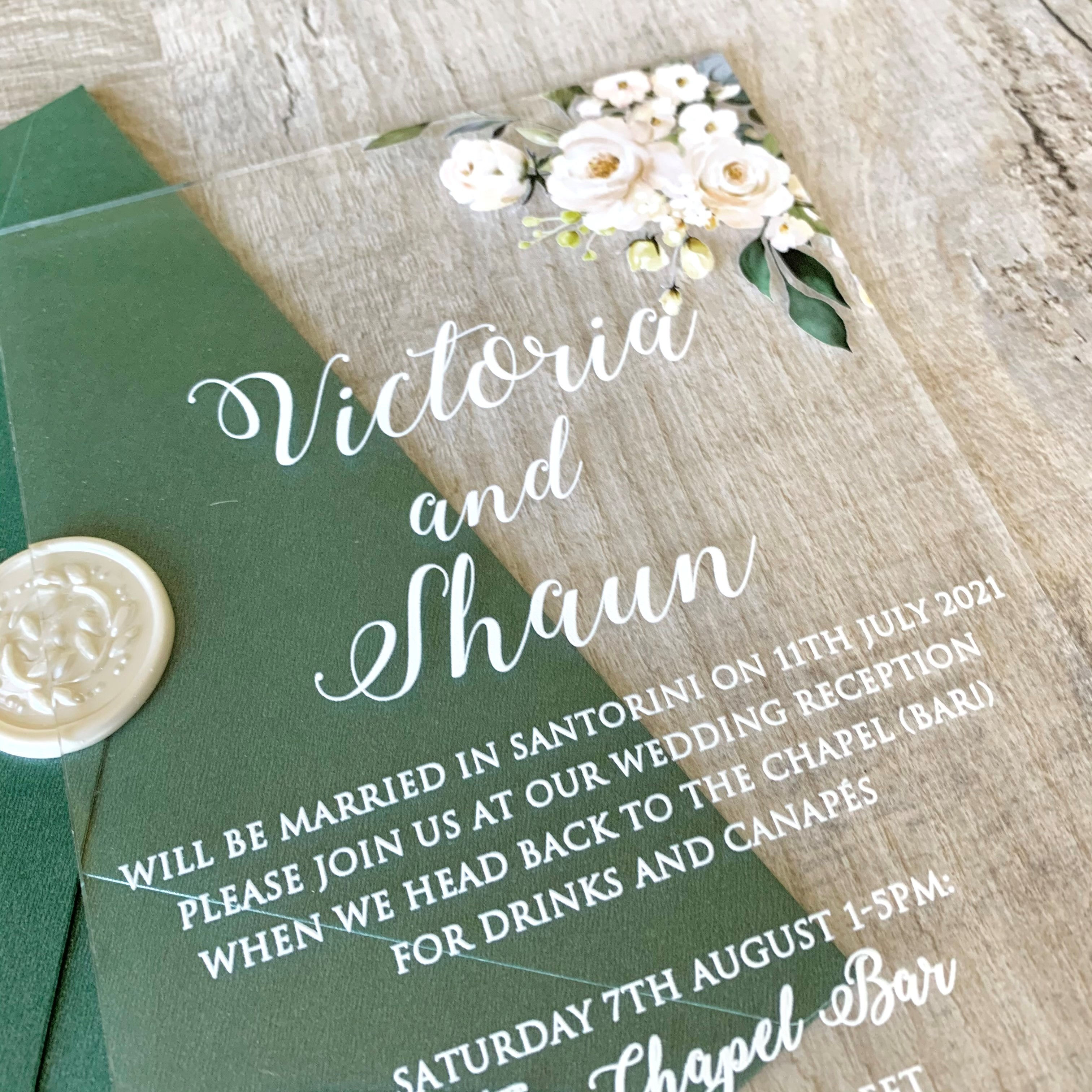 Clear acrylic wedding invitation with white ivory flowers