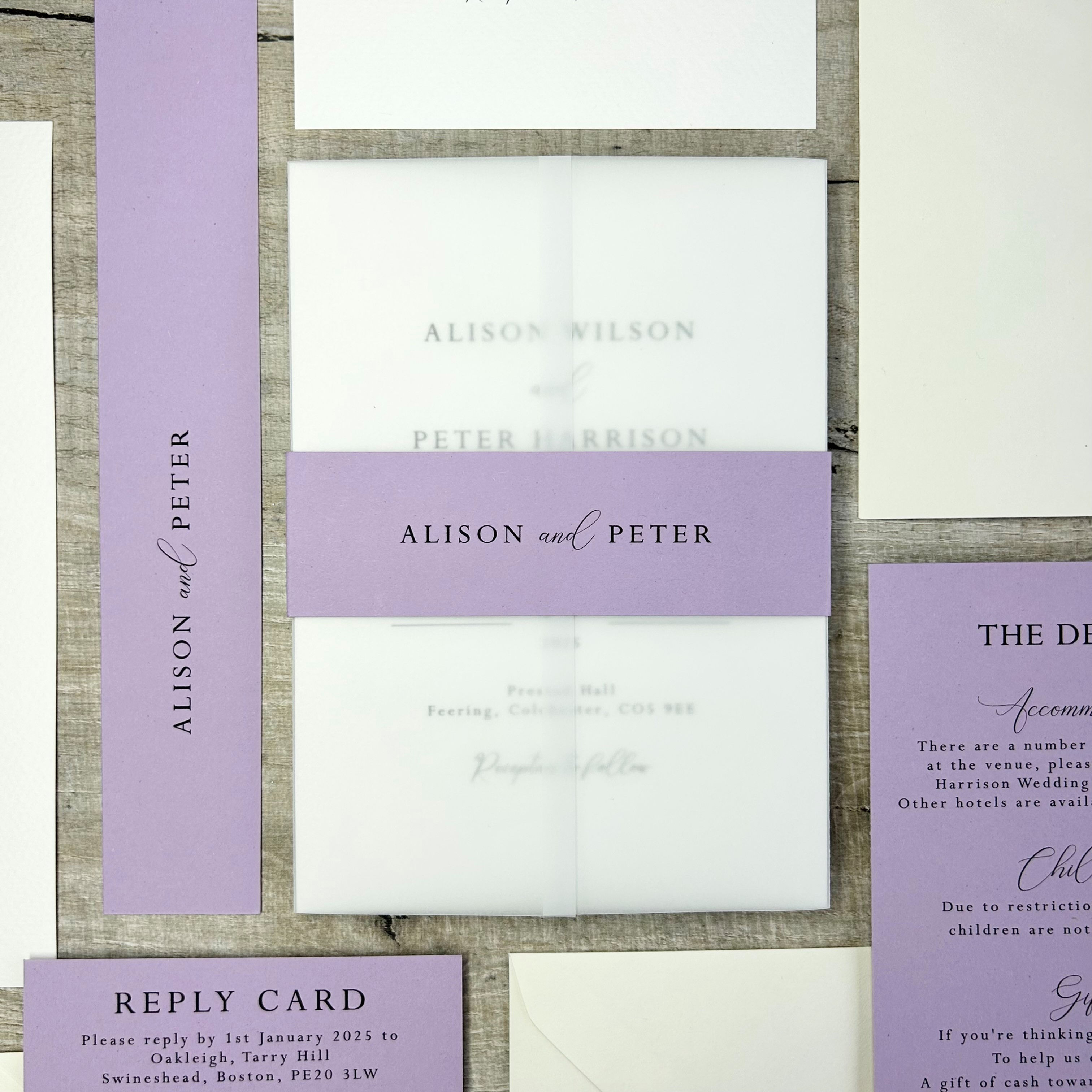 vellum wedding invitation with a lavender belly band