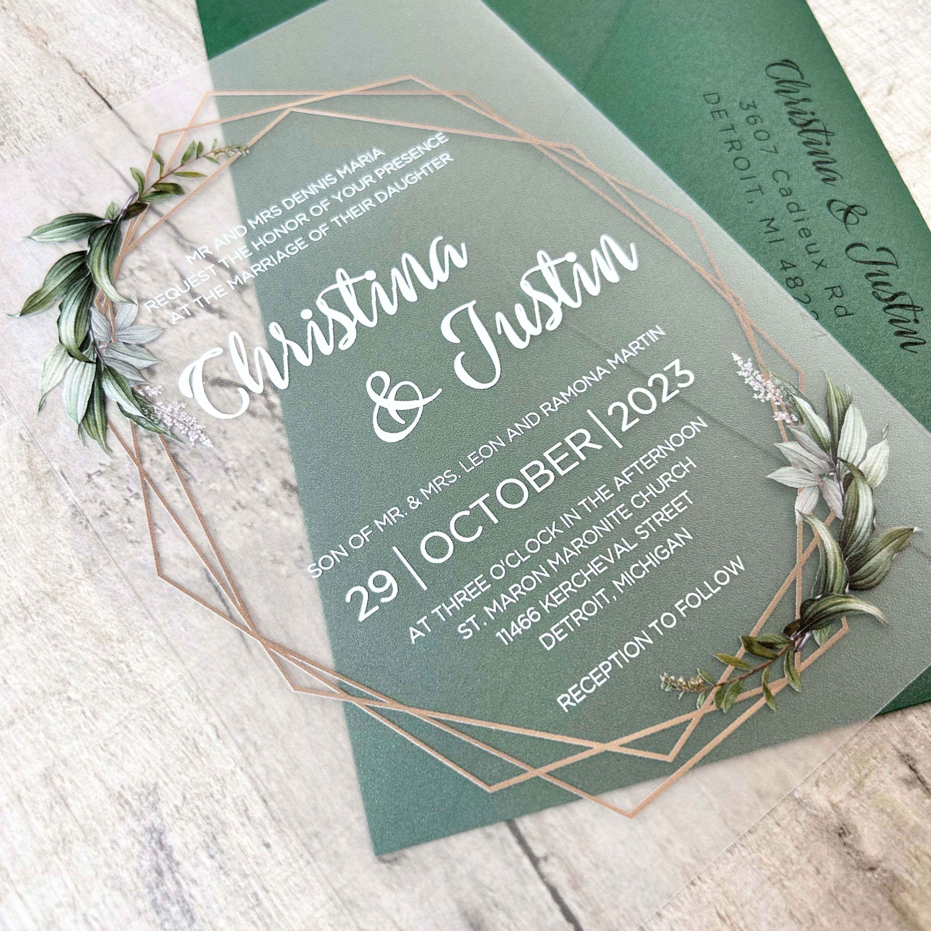 Greenery and geometric frame printed on a frosted acrylic wedding invitation