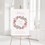 Thumbnail: welcome sign with printed wreath with mauve coloured flowers