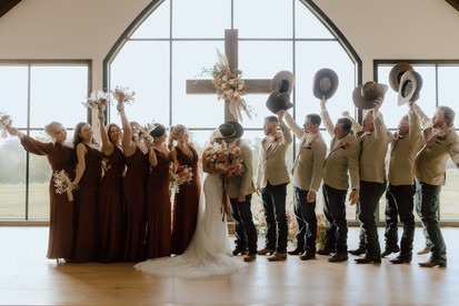 bridal party photos in church during western wedding day