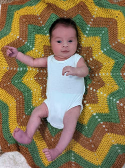 Baby on bamboo blanket