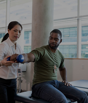 PT patient lifting dumbbell