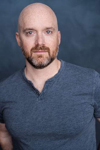 A headshot of actor Ned Donovan