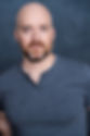 A headshot of actor Ned Donovan