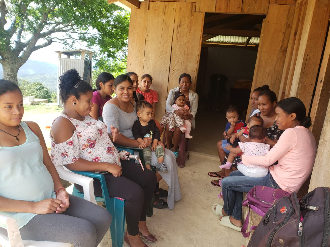 Women's group meeting in Pacayal, where women share their experiences with pregnancy and childcare