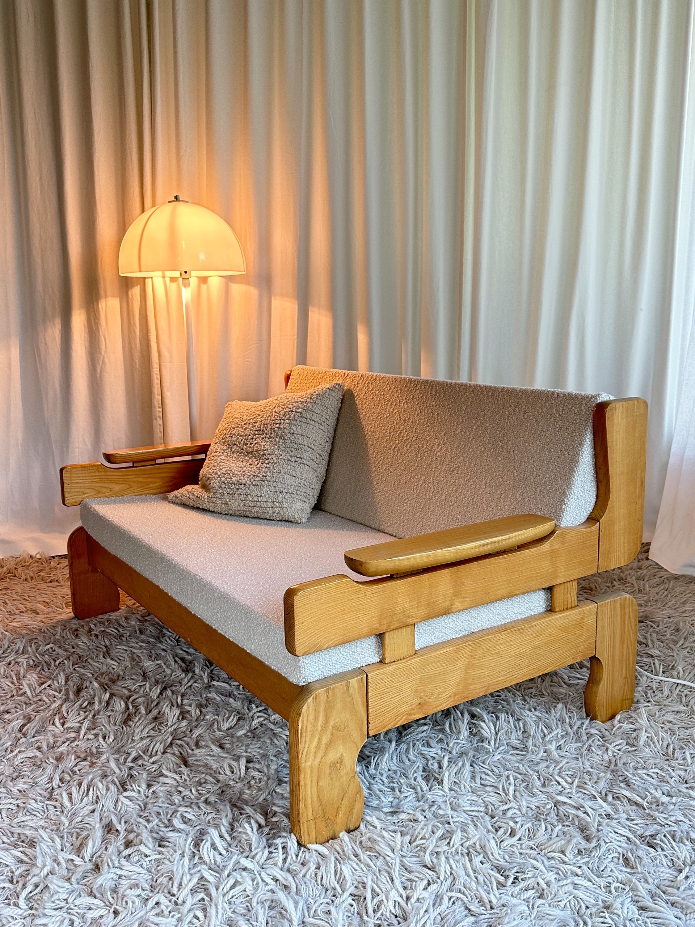 Sculptural, brutalist 2 seat sofa in massive oak, new upholstery. 
