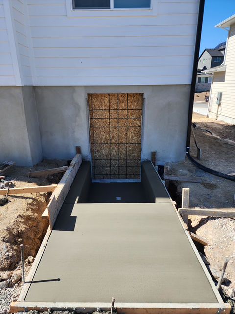 Poured and finished basement walkout onto a landing.