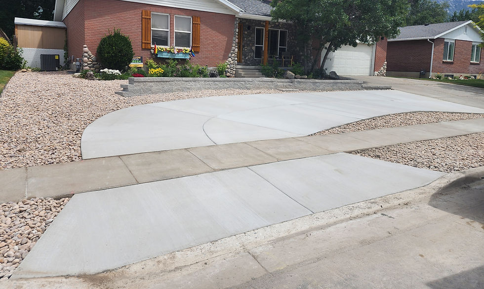 This is a wrap around driveway. With rock landscape and a block retaining wall.